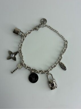 Vintage Silver Charm Bracelet with Lock and Logo Medallion